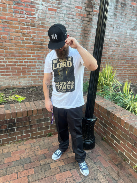 Proverbs 18:10 – Strong Tower Tee
“The name of the Lord is a strong tower.”