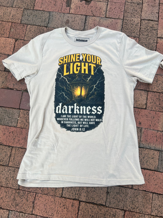 John 8:12 – Shine Your Light Tee
“The light shines in the darkness.”